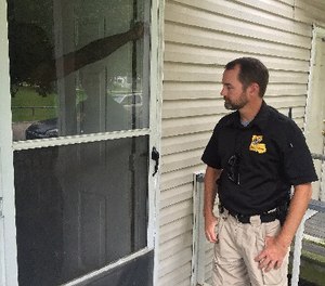 In this June 20, 2017 photo, a probation officer checks in on one of the 140 cases he handles in Baton Rouge, La. (AP Photo/R.J. Rico)
