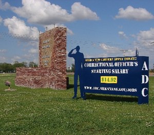 A recruiting sign for the Arkansas Department of Correction greets visitors to the Cummins Unit prison near Varner, Arkansas, which was scheduled to hold executions Thursday, April 20, 2017.