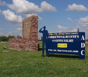 A recruiting sign for the Arkansas Department of Correction greets visitors to the Cummins Unit prison near Varner, Arkansas, which was scheduled to hold executions Thursday, April 20, 2017.