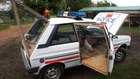 Police car converted into chicken coop