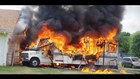 Early video: RV and SUV fire threaten Ill. home