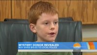 Boy donates savings to police