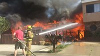 Vacationing firefighters help battle 2-alarm fire