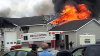 Firefighter stranded on roof at commercial fire