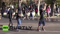 Chilean police fight protesters with water cannon