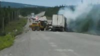 Truck ablaze on highway is water bombed