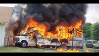 Early video: RV and SUV fire threaten Ill. home