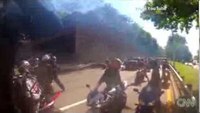 Driver runs over biker, gets attacked by other bikers