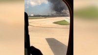 Plane catches fire at Fla. airport; 15 hurt, 1 burned