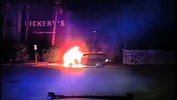 Police officer saves man from burning car