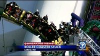 Firefighters rescue dozens stranded on roller coaster