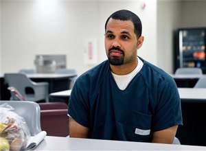 Rene Lima-Marin sits for an interview with The Associated Press about the circumstances of his sentencing and incarceration, in a meeting room inside Kit Carson Correctional Center, a privately operated prison in Burlington, Colo. (AP Photo/Brennan Linsley)