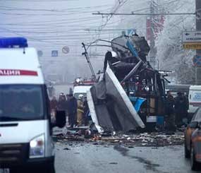 Experts and police officers examine a site of a trolleybus explosion in Volgograd, Russia Monday, Dec. 30.
