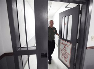 Mount Olive maximum security prison warden, David Ballard, walks out of the secure area at the prison in Mount Olive, W. Va. (AP Photo/Steve Helber)