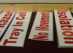 Signs listing special restrictions for inmates at the Washington Corrections Center in Shelton, Wash. are shown. (AP Photo/Ted S. Warren)