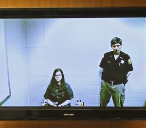 Anissa Weier, left, appears via video link from the Washington County Secure Detention Center where she is being held, during a hearing in Waukesha County Court, Friday, Nov. 11,2016, in Waukesha, Wis. (Michael Sears/Milwaukee Journal-Sentinel via AP, Pool)