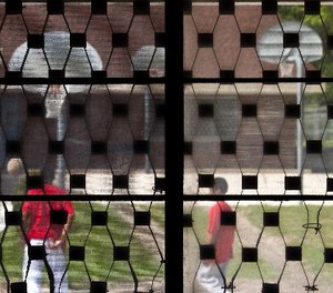 In this May 20, 2010, file photo some youths are seen playing basketball through bars on a window at the Wisconsin Department of Corrections Ethan Allen School in Wales, Wis. (AP Photo/Morry Gash, File)