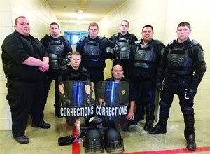 Kneeling, from left: Kevan Sipla, Marcus Hernandez, (standing) Sgt. Angelo Brock, Joshua Huff, Kenneth Koepsell, Bradley Morris, Cpl. Daniel Gonzales and Joshua Howard.