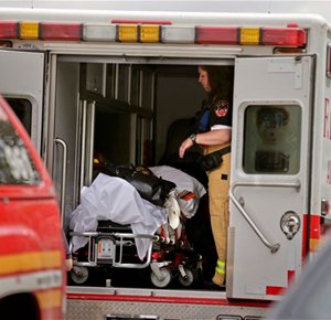 A New York City fire department EMT prepares to transport a woman who was evacuated from a subway train after it derailed in the Queens borough of New York, Friday, May 2, 2014. The express F train was bound for Manhattan and Brooklyn when it derailed at 10:40 a.m. about 1,200 feet (365 meters) south of the 65th Street station, according to the Metropolitan Transportation Authority. Dozens of firefighters and paramedics with stretchers converged on Broadway and 60th Street, where passengers calmly left the tunnel through the sidewalk opening. A few were treated on stretchers. (AP Photo/Julie Jacobson)
