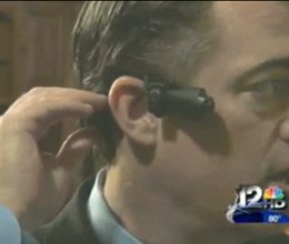 The Taser Cam fits like a bluetooth device.