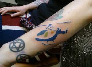 Photo Kent, Sussex and Surrey Air Ambulance
Laura Flight's tattoo of the Kent, Sussex and Surrey Air Ambulance logo was donated by a local tattoo parlor.