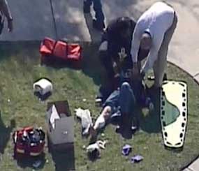 In this frame grab provided by KPRC Houston, an unidentified person is attended to by emergency personnel at Lone Star College Tuesday, Jan. 22, 2013, in Houston, where law enforcement officials say the community college is on lockdown amid reports of a shooter on campus.