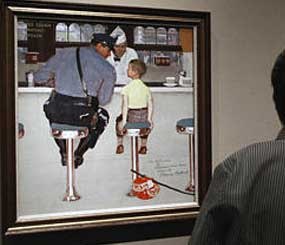 Visitors at The Norman Rockwell Museum in Stockbridge, Mass., view the 1958 paintings