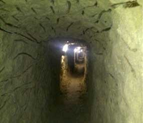 This image provided Thursday July 12, 2012, by the U.S. Immigration and Customs Enforcement shows a tunnel discovered by authorities designed to smuggle drugs into the United States, found in Tijuana, Mexico. (AP Photo/ICE)