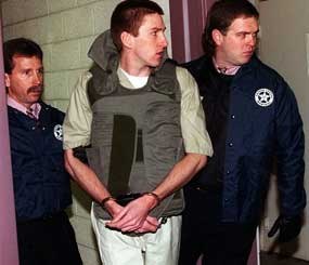 In this Jan. 31, 1996 file photo, Timothy McVeigh is escorted by two unidentified U.S. Marshals to a hearing in Federal Court in downtown Oklahoma City.