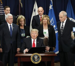 President Donald Trump, accompanied by Vice President Mike Pence, Homeland Security Secretary John F. Kelly, and others, speaks during a visit to the Homeland Security Department in Washington, Wednesday, Jan. 25, 2017. (AP Photo/Pablo Martinez Monsivais)