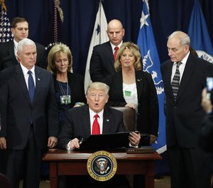 President Donald Trump, accompanied by Vice President Mike Pence, Homeland Security Secretary John F. Kelly, and others, speaks during a visit to the Homeland Security Department in Washington, Wednesday, Jan. 25, 2017.