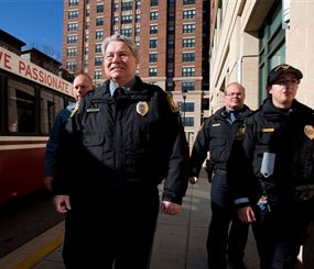 This photo shows University of Maryland Police Chief David Mitchell, second from left, and UMPD Police Officers, from left, Mike Weller, Robert Jenshoej, and Sgt. Rosanne Hoaas, walking on a sidewalk at the extended jurisdiction area of the University of Maryland in College Park.