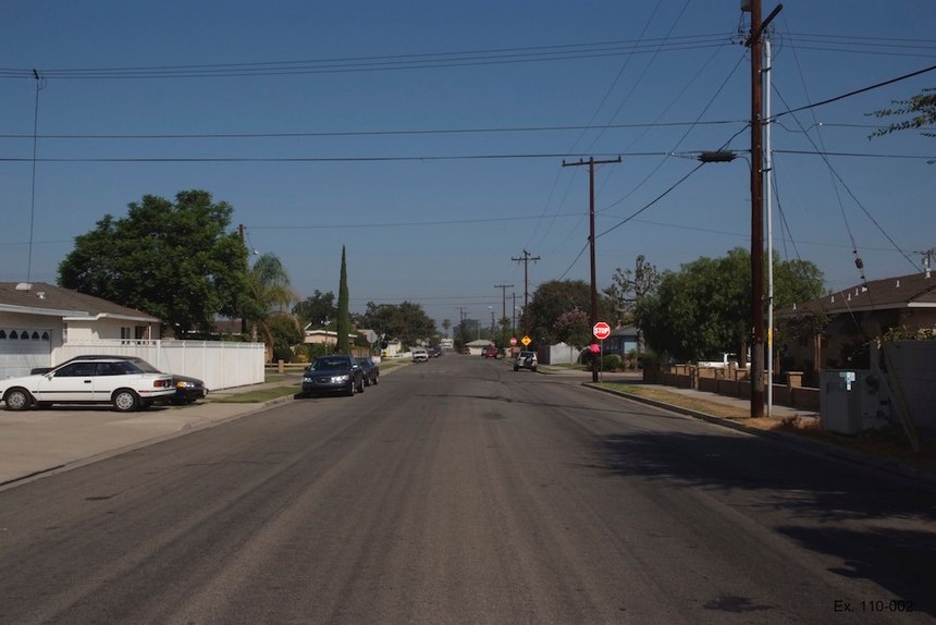 This photo shows the scene looking northbound on Bond Street. The first intersection is Willow and the end of the street is the T intersection at Broadway. It was taken by the crime lab on the morning after the incident. Photo courtesy of Anaheim City Attorney’s Office.