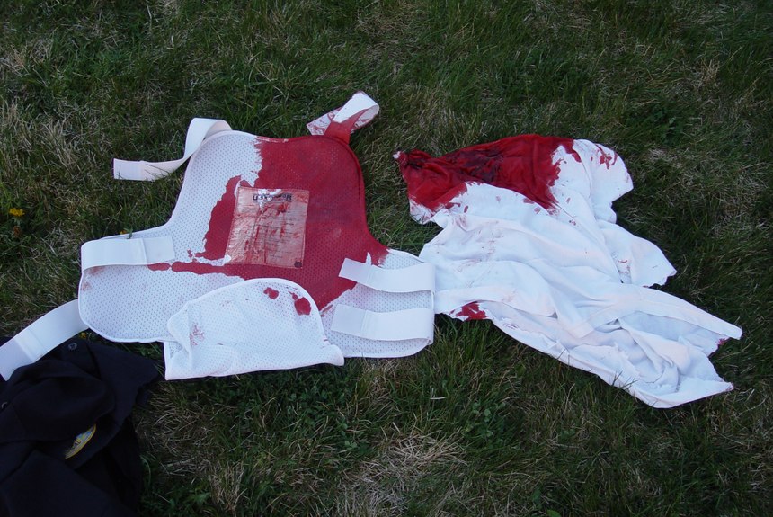 His blood-soaked vest shows how close Lt. Phil Murphy came to losing his life. (Photo/Miriam Murphy)