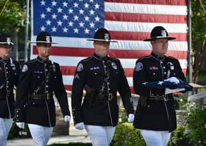 From left, Westminster PD Honor guards Sgt. Kevin MacCormick, Officer Kees Davis, Cpl. Jeremy Fletcher and Investigator James Delk at an annual ceremony honoring the three WPD fallen officers currently named on the memorial. (File photo/Steven Georges/Behind the Badge OC)