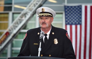 AF&R Fire Chief Pat Russell addresses the walkers who participated in a remembrance walk to start the Phoenix World Burn Congress at the Anaheim Convention Center.
