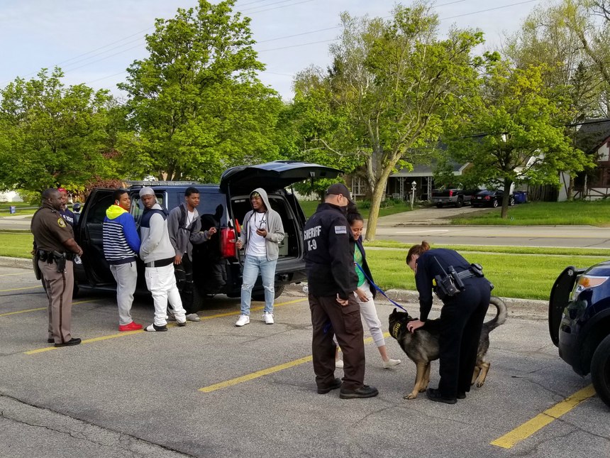 Part of the School Emergency Response Coalition's Career Day includes working with a K9 unit.