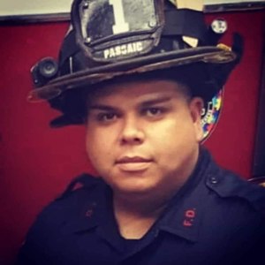 Passaic Firefighter Israel Tolentino Jr., 33, died from COVID-19 on March 31, 2020. He is survived by his wife Maria Vazquez, daughter Ailani, 9, and son Israel III, 7. (Photo/NJ FMBA Facebook)
