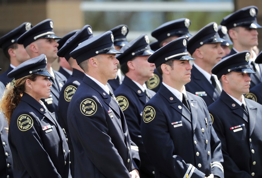 Firefighters attend the funeral for Appleton firefighter Mitchell F. Lundgaard, at the Appleton Alliance Church on Monday, May 20, 2019, in Grand Chute, Wis. The 14-year veteran of the Appleton Fire Department was fatally shot while responding to a medical emergency at the downtown Valley Transit Center on May 15, in Appleton, Wis. (William Glasheen/The Post-Crescent via AP)