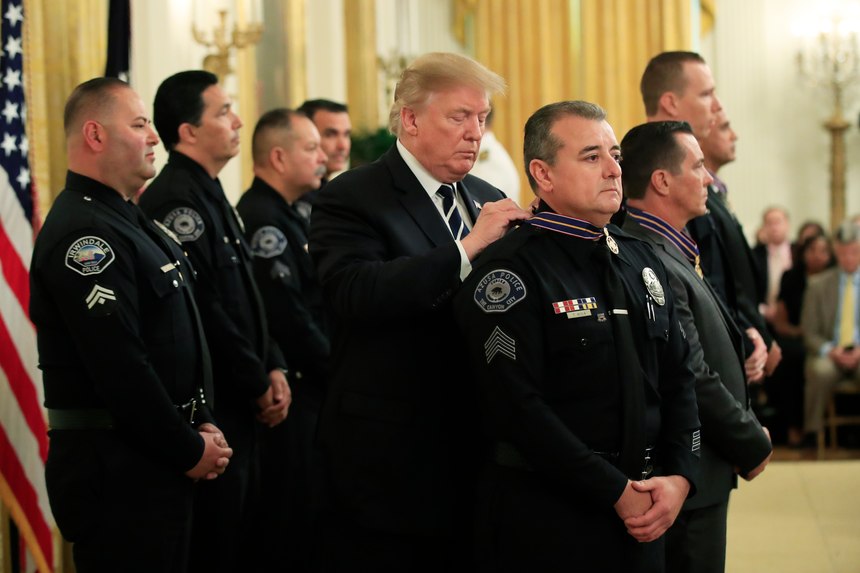 President Donald Trump awards Sgt. Thomas Avila III of the Azusa (Calif.) Police Department the Public Safety Officer Medal of Valor during a ceremony in the East Room of the White House in Washington, Wednesday, May 22, 2019.