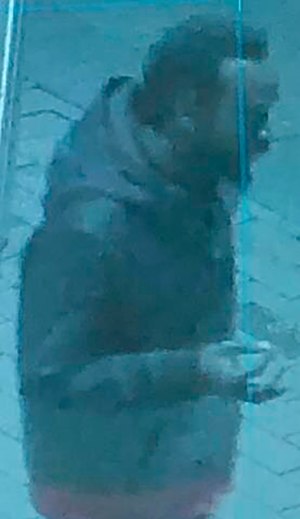 This surveillance image shows a man approaching a ballot drop box outside the Boston Public Library, early Sunday, Oct. 25, 2020, in downtown Boston.
