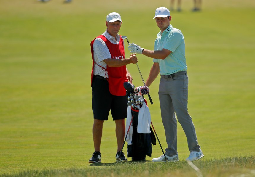 Matt Parziale, right, takes a club from his caddie and father, Vic Parziale, on the first fairway during the final round of the U.S. Open Golf Championship, Sunday, June 17, 2018, in Southampton, N.Y.