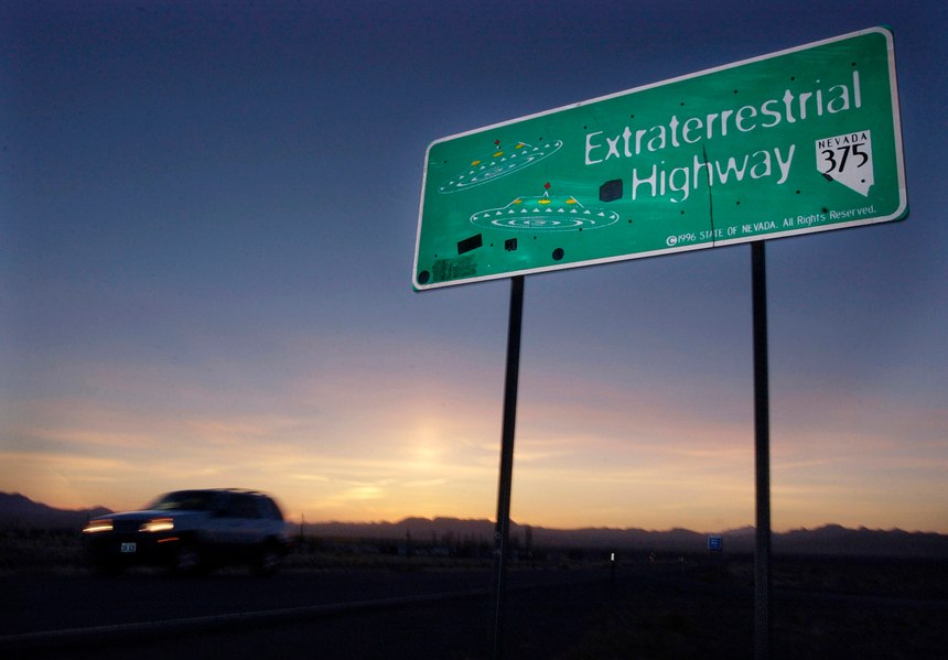 A vehicle moves along the Extraterrestrial Highway near Rachel, Nevada, the closest town to Area 51. The U.S. Air Force has warned people against participating in an internet joke suggesting a large crowd of people "storm Area 51," the top-secret Cold War test site in the Nevada desert. (AP Photo/Laura Rauch, File)