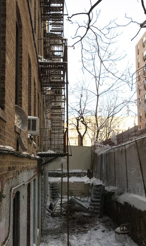 The side of a Bronx building is shown where firefighters were killed and others injured when they jumped from the building.