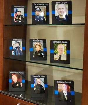 Photos of officers lost to suicide on display at the 2019 Blue H.E.L.P. Police Week event