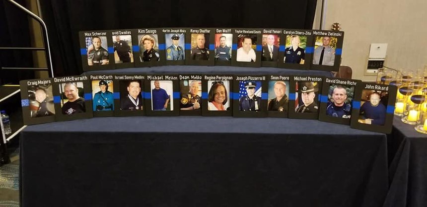 Photos of officers lost to suicide on display at the at the 2019 Blue H.E.L.P. Police Week event.