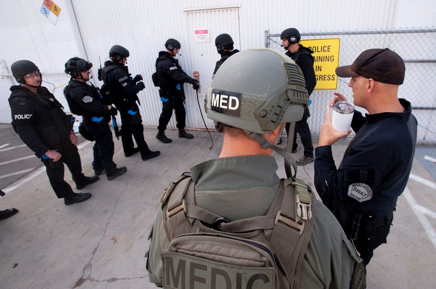 Dr. Joshua Bobko, right, walks back into a warehouse where West (Orange) County SWAT was holding a training exercise in Fountain Valley on Wednesday, October 16, 2019. (Photo/Paul Rodriguez)