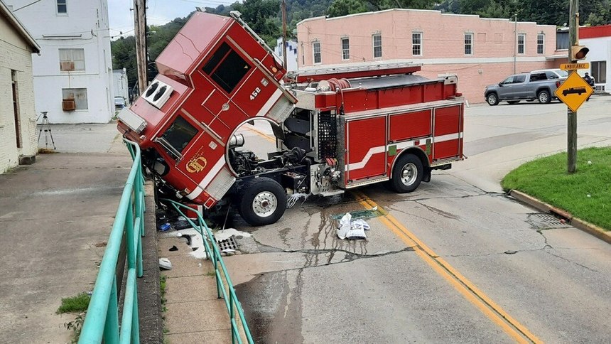 A Charleston Fire Department fire truck crashed, injuring a firefighter, when the spring brakes (parking brake) failed during the truck check, allowing the truck to roll forward.