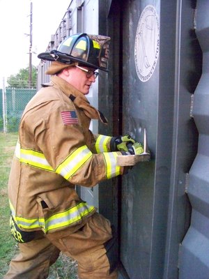 Figure 7: Force the adz and spike end of the Halligan toward the face of the door until entry is gained.