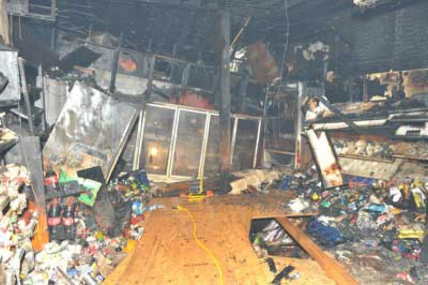 Interior view of deli following partial floor collapse and recovery operations.